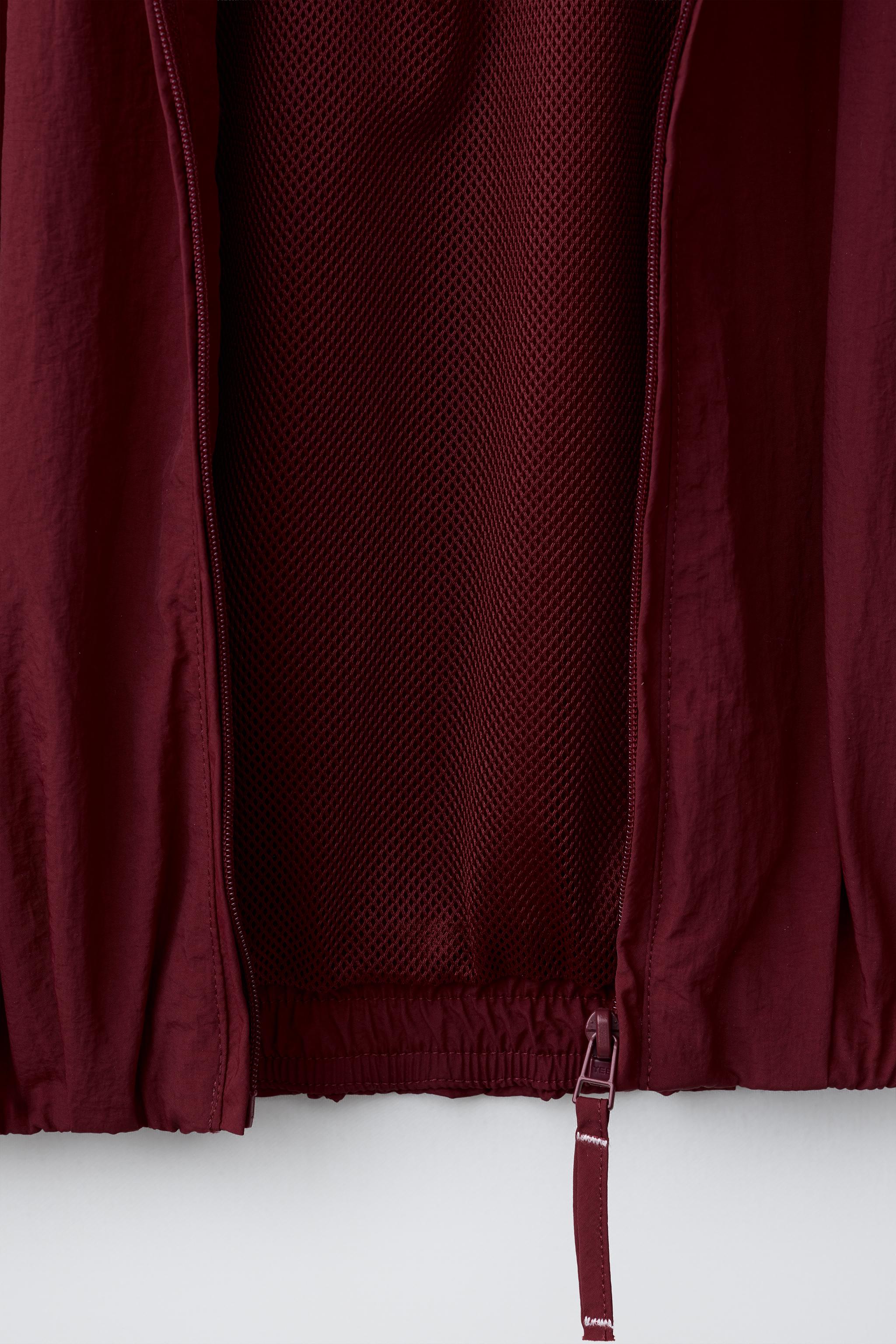 BLOUSON SPORT À LISERÉS CONTRASTANTS